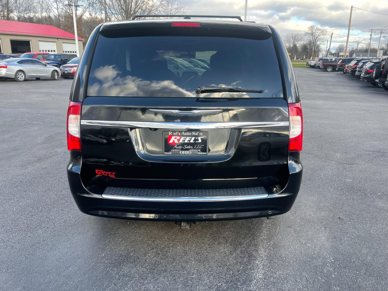 2012 Black /Black Chrysler Town & Country (2C4RC1BG0CR) with an 3.6L V6 DOHC 24V FFV engine, 6-Speed Automatic transmission, located at 11115 Chardon Rd. , Chardon, OH, 44024, (440) 214-9705, 41.580246, -81.241943 - This 2012 Chrysler Town & Country Touring - L model features a luxurious interior with cloth seats that are heated for comfort, complemented by a heated steering wheel for added warmth in cooler weather. It comes equipped with a convenient tow package, enhancing its utility for pulling trailers or b - Photo #8